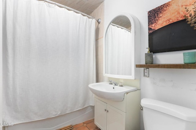 full bath with vanity, toilet, tile patterned flooring, and shower / bath combo with shower curtain