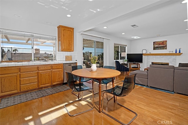 2332 Mccrea Rd, Thousand Oaks, CA 91362 - dining space featuring light wood finished floors, plenty of natural light, recessed lighting, and a fireplace