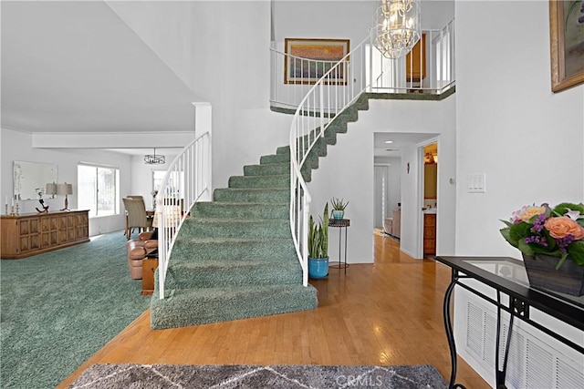 2332 Mccrea Rd, Thousand Oaks, CA 91362 - stairs with a chandelier, a high ceiling, and wood finished floors