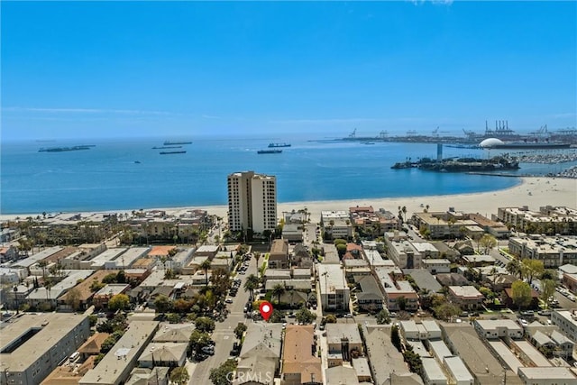 birds eye view of property with a city view and a water view