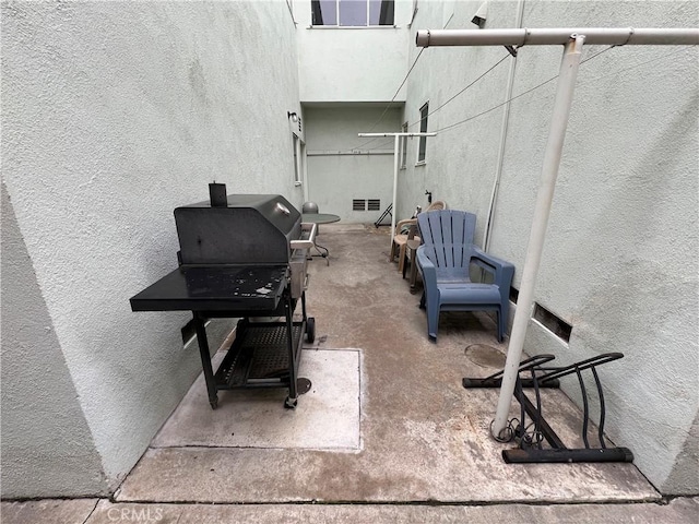 view of patio with a grill