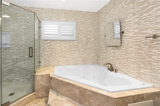 401 Holmwood Dr, Newport Beach, CA 92663 - bathroom with tile walls, a tub with jets, and a stall shower