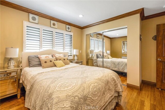 401 Holmwood Dr, Newport Beach, CA 92663 - bedroom with wood finished floors, crown molding, baseboards, and recessed lighting