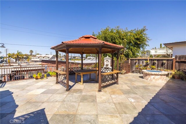401 Holmwood Dr, Newport Beach, CA 92663 - view of patio with a gazebo, fence, and an outdoor fire pit