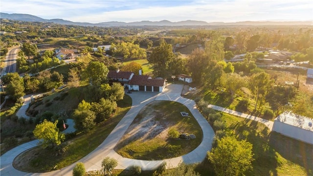 birds eye view of property featuring a mountain view