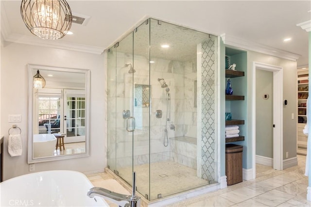 full bathroom featuring a shower stall, a freestanding bath, ornamental molding, and marble finish floor
