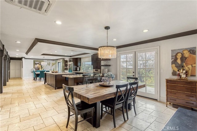 dining area featuring visible vents, recessed lighting, stone tile flooring, and crown molding