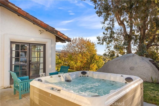 view of patio / terrace featuring a hot tub