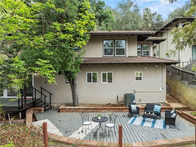 3476 Linda Vista Rd, Glendale, CA 91206 - rear view of property with central AC, stucco siding, and a deck