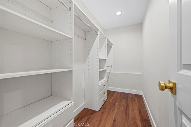 3476 Linda Vista Rd, Glendale, CA 91206 - walk in closet with dark wood-style flooring