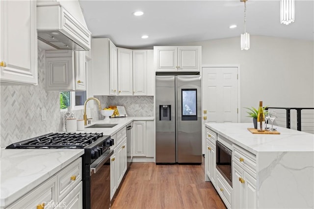 3476 Linda Vista Rd, Glendale, CA 91206 - kitchen with white cabinets, tasteful backsplash, appliances with stainless steel finishes, a sink, and light wood-type flooring