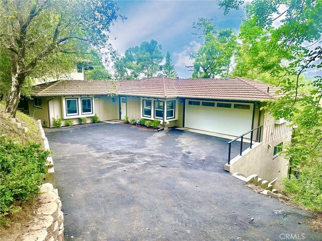 3476 Linda Vista Rd, Glendale, CA 91206 - single story home with aphalt driveway, a garage, and a tiled roof