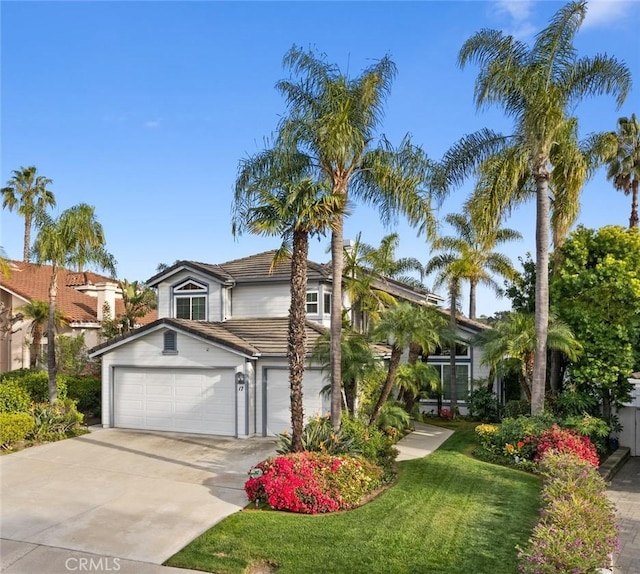 17 Ridgerock, Laguna Niguel, CA 92677 - view of front facade with a tile roof, driveway, a front lawn, and a garage