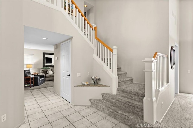 17 Ridgerock, Laguna Niguel, CA 92677 - stairway with tile patterned flooring, a towering ceiling, baseboards, and recessed lighting