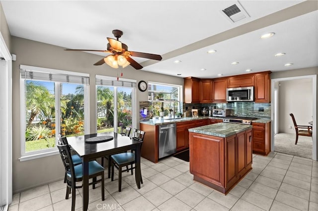 17 Ridgerock, Laguna Niguel, CA 92677 - kitchen featuring stainless steel appliances, healthy amount of natural light, a sink, decorative backsplash, and recessed lighting