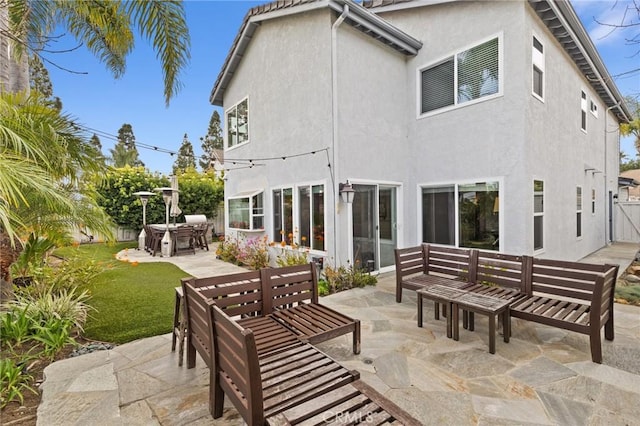 17 Ridgerock, Laguna Niguel, CA 92677 - rear view of house featuring a patio area, stucco siding, a yard, and an outdoor hangout area