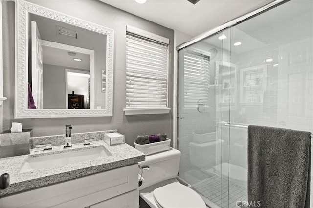 17 Ridgerock, Laguna Niguel, CA 92677 - bathroom with vanity, toilet, a shower stall, and recessed lighting