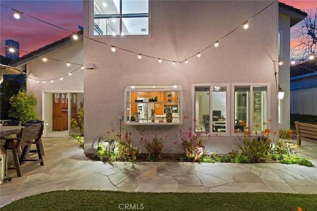 17 Ridgerock, Laguna Niguel, CA 92677 - back of property featuring a patio, stucco siding, and outdoor dining area