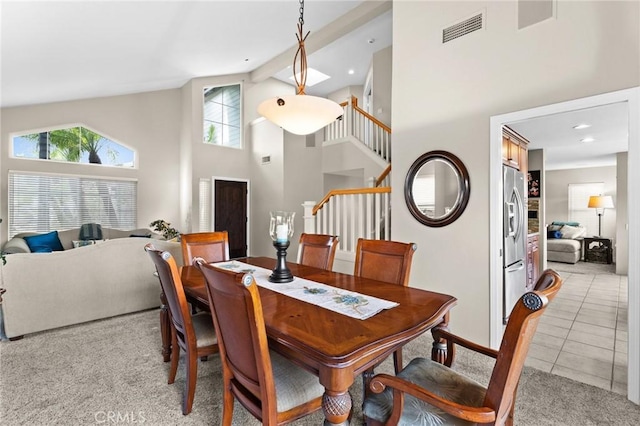 17 Ridgerock, Laguna Niguel, CA 92677 - dining space with high vaulted ceiling, light carpet, stairs, and light tile patterned flooring