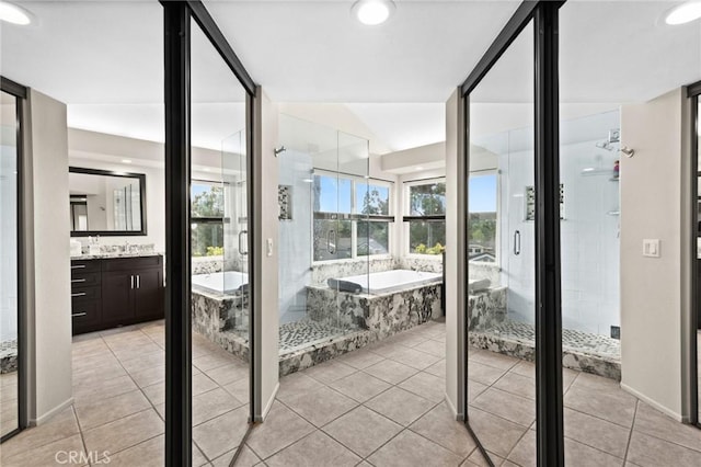 17 Ridgerock, Laguna Niguel, CA 92677 - bathroom with vanity, a garden tub, a shower stall, tile patterned flooring, and recessed lighting