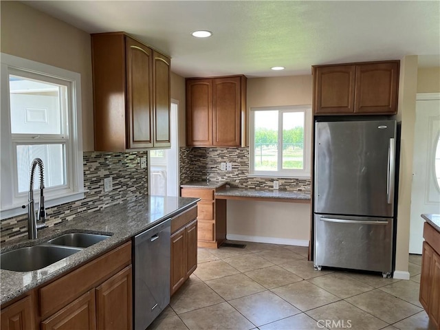 11122 Schafer Ave, Los Molinos, CA 96055 - kitchen with appliances with stainless steel finishes, a sink, backsplash, stone countertops, and light tile patterned flooring