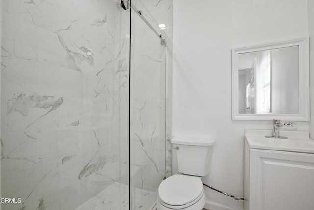 bathroom featuring vanity, toilet, and a marble finish shower