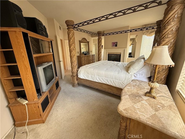 1050 Ginger Cir, Corona, CA 92879 - carpeted bedroom featuring a tile fireplace and visible vents