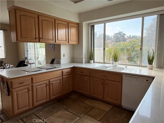 1050 Ginger Cir, Corona, CA 92879 - kitchen featuring white dishwasher, a sink, light countertops, stone finish floor, and stovetop