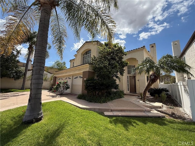 1050 Ginger Cir, Corona, CA 92879 - mediterranean / spanish-style home with a garage, a front lawn, fence, stucco siding, and driveway