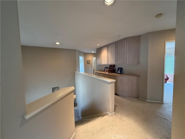 1050 Ginger Cir, Corona, CA 92879 - kitchen with recessed lighting, baseboards, and light carpet