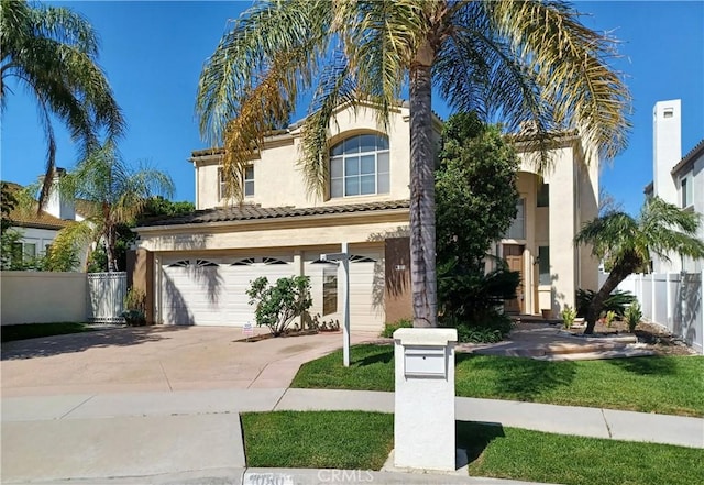 1050 Ginger Cir, Corona, CA 92879 - mediterranean / spanish house with fence, stucco siding, an attached garage, driveway, and a tile roof