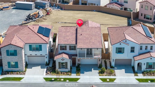 birds eye view of property with a residential view