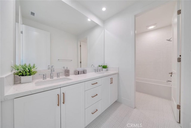 full bath with shower / bathing tub combination, double vanity, recessed lighting, and a sink