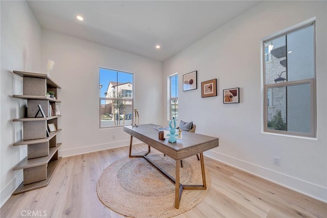 office area featuring light wood finished floors, baseboards, and recessed lighting