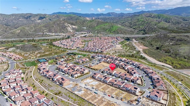 bird's eye view with a residential view and a mountain view