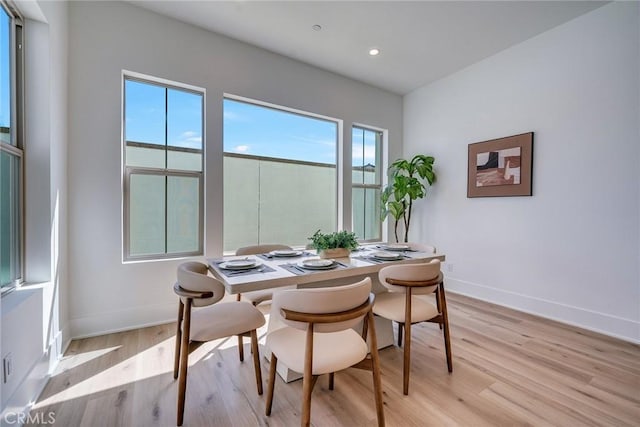 dining area with recessed lighting, baseboards, and light wood-type flooring