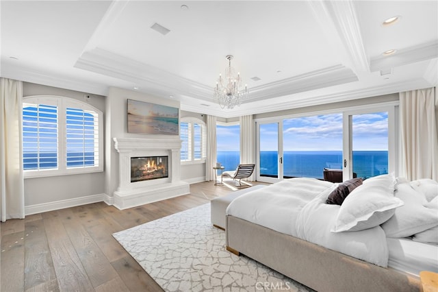 31821 Monarch Crst, Laguna Niguel, CA 92677 - bedroom with access to outside, a glass covered fireplace, crown molding, and a chandelier
