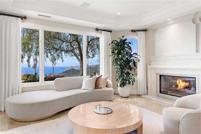 31821 Monarch Crst, Laguna Niguel, CA 92677 - living room featuring crown molding, a raised ceiling, a water view, a premium fireplace, and recessed lighting