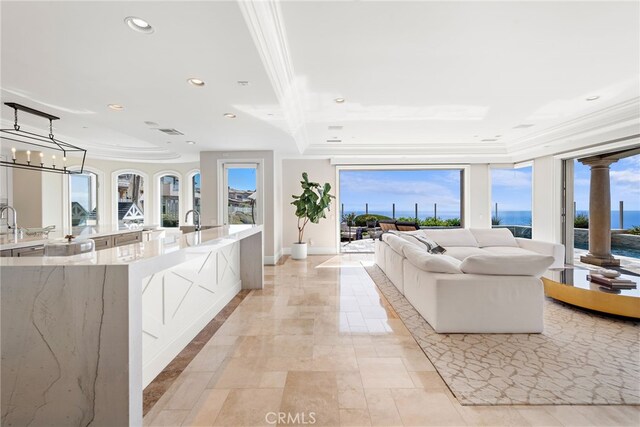31821 Monarch Crst, Laguna Niguel, CA 92677 - living room with crown molding, plenty of natural light, recessed lighting, and a water view