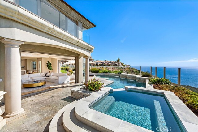 31821 Monarch Crst, Laguna Niguel, CA 92677 - view of pool with a water view, a patio, an outdoor living space, and a pool with connected hot tub