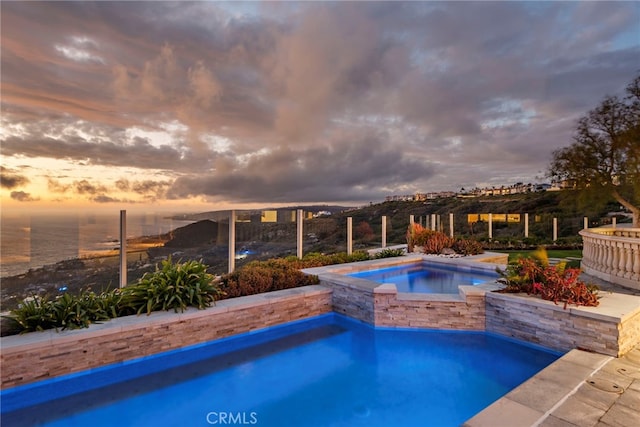 31821 Monarch Crst, Laguna Niguel, CA 92677 - pool at dusk with a pool with connected hot tub