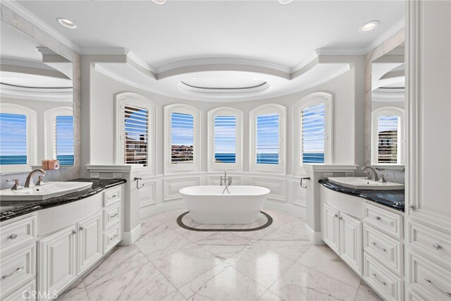 31821 Monarch Crst, Laguna Niguel, CA 92677 - bathroom with crown molding, two vanities, recessed lighting, healthy amount of natural light, and a decorative wall