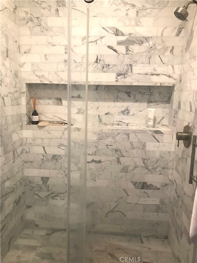 full bath with a shower stall