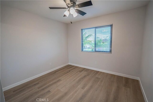 11845 Gladstone Ave, Sylmar, CA 91342 - unfurnished room featuring baseboards, wood finished floors, and a ceiling fan