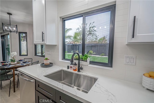 11845 Gladstone Ave, Sylmar, CA 91342 - kitchen with a sink, plenty of natural light, and stainless steel dishwasher