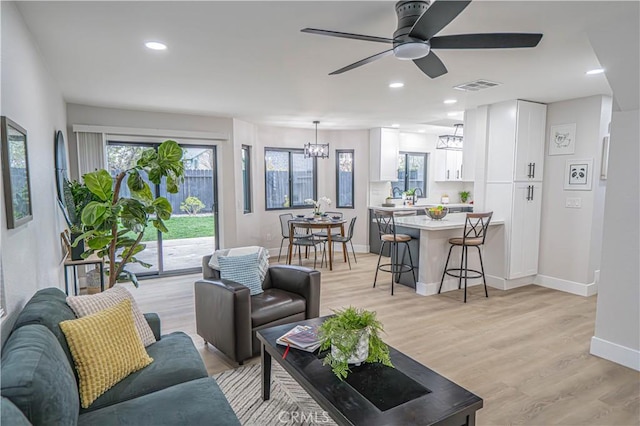 11845 Gladstone Ave, Sylmar, CA 91342 - living room featuring a chandelier, plenty of natural light, baseboards, light wood-style flooring, and recessed lighting