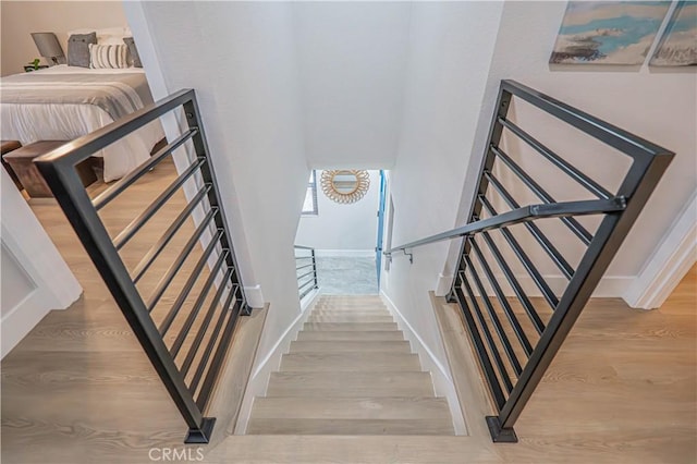 11845 Gladstone Ave, Sylmar, CA 91342 - staircase with wood finished floors and baseboards