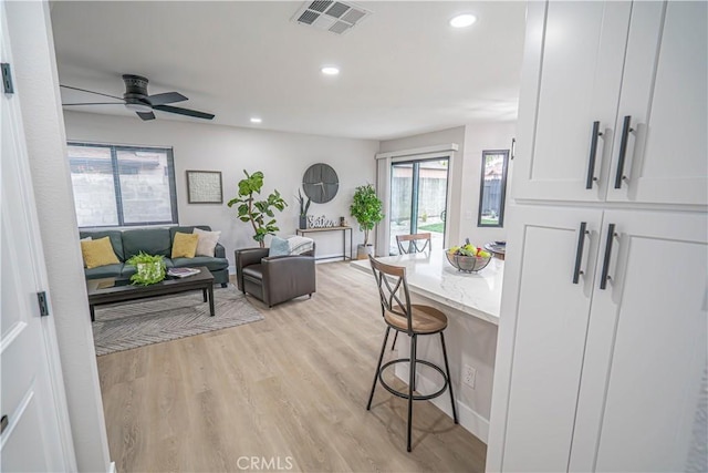 11845 Gladstone Ave, Sylmar, CA 91342 - living room featuring light wood-style floors, a ceiling fan, and recessed lighting