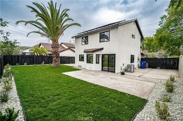 11845 Gladstone Ave, Sylmar, CA 91342 - back of property featuring stucco siding, a patio area, and central AC