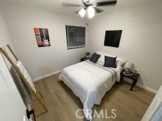 11845 Gladstone Ave, Sylmar, CA 91342 - bedroom featuring wood finished floors, baseboards, and ceiling fan